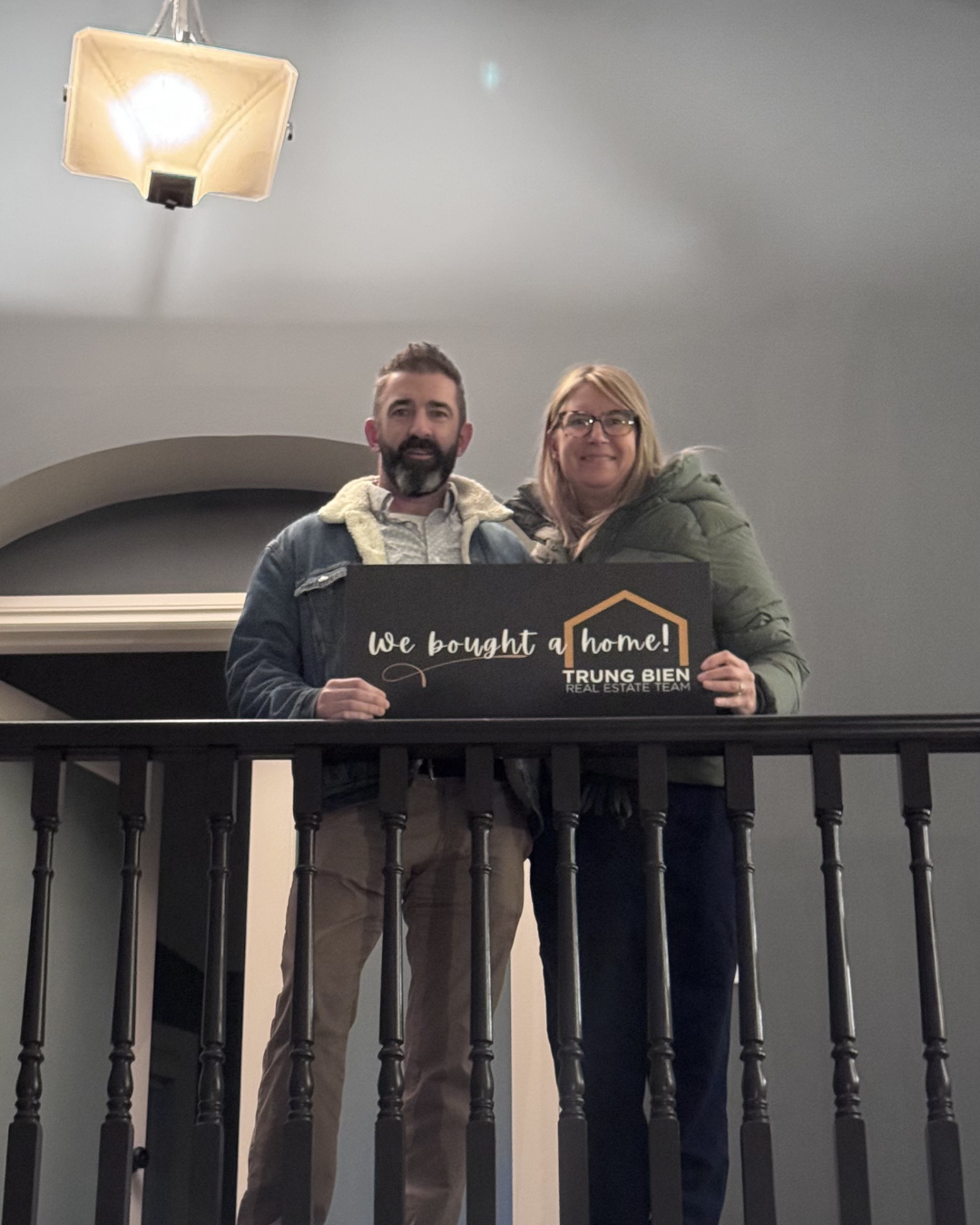 Trung Bien with client after buying their home